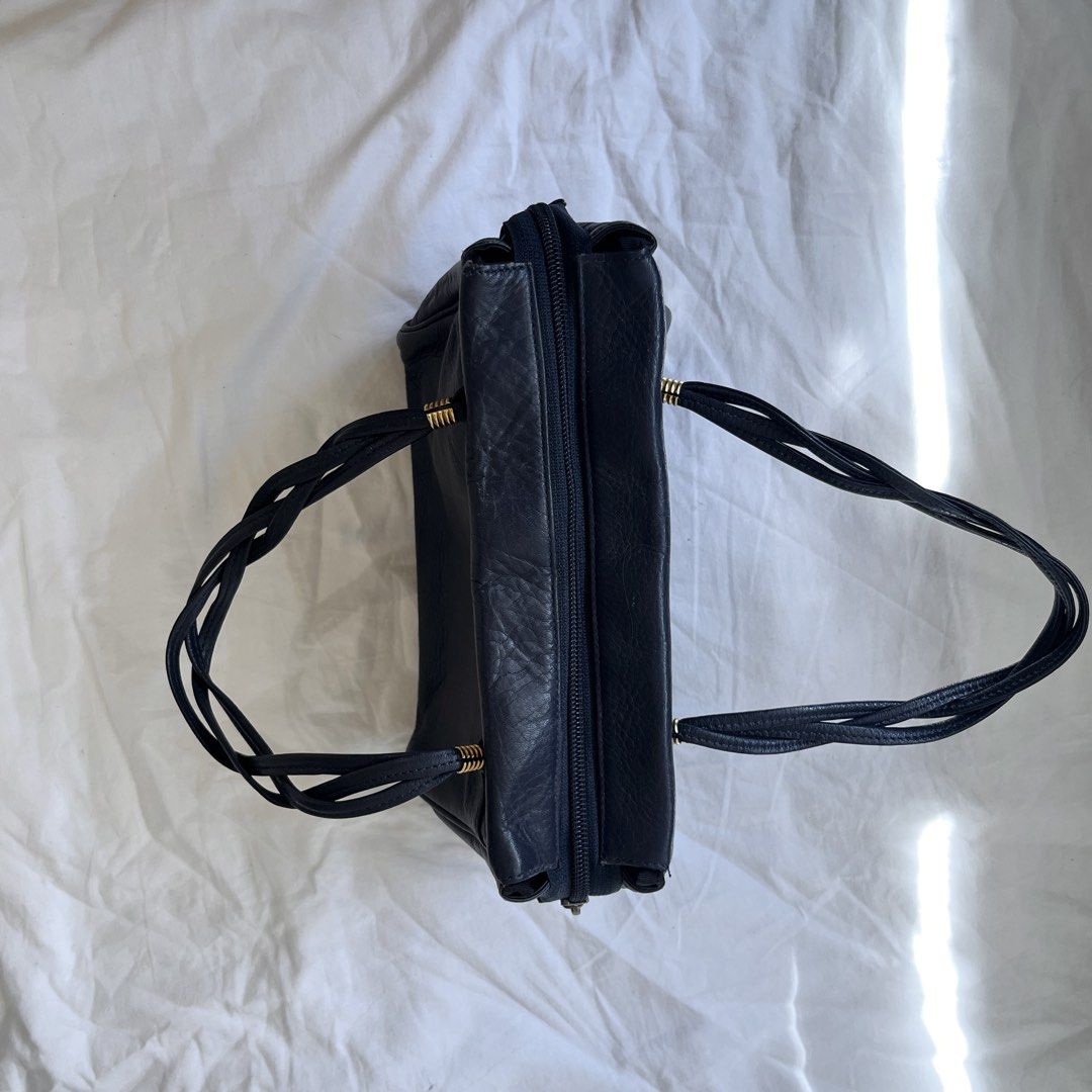 Dark Blue Hand Bag (Category: Purses & Pouches) located in Manila. Submitted by dolledleo (Listing ID 1463974214, Image 2). Description: - Compact - Dark blue color, almost black - Has gold hardware - No flaw .