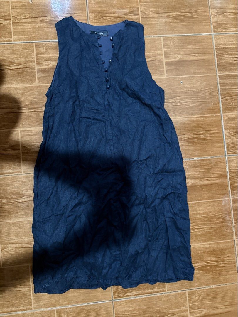 Dark Blue Sleeveless Button-Up Dress (Category: Dresses) located in Manila. Submitted by enazy (Listing ID 1463992262, Image 1). Description: - Dark blue sleeveless dress - Button-up front with small buttons - Crinkled texture fabric, likely a linen blend - Ideal for casual occasions.