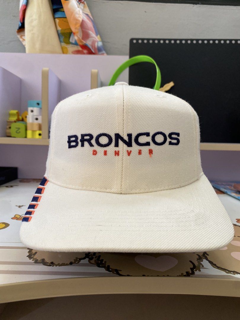 Denver Broncos Snapback Cap (Category: Caps & Hats) located in Iloilo. Submitted by jlpogi27 (Listing ID 1463983214, Image 1). Description: - White Denver Broncos snapback cap - Embroidered team name on the front - Small embroidered logo on the side - Adjustable strap at the back for a custom fit - Ideal for any Denver Broncos fan.