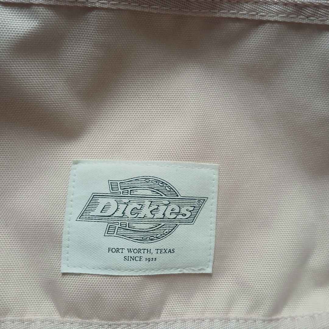 Dickies Nylon Flap Crossbody Messenger Bag (Category: Cross-body Bags) located in Cagayan de Oro. Submitted by susanthrifts (Listing ID 1463951721, Image 3). Description: ​Off-white/light pink Dickies nylon messenger bag featuring a front zip pocket, flap closure, adjustable shoulder strap, and classic Dickies patch branding. ​Brand: Dickies ​Model Code: DK009531C031 ​Color: Light Pink / Off-White ​Material: 100% Polyester ​Hardware: YKK Zippers 