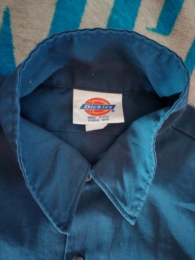 Dickies Short Sleeve Work Shirt Navy Blue (Category: Tshirts & Polo Shirts ) located in Mangaldan. Submitted by niftythrifty69 (Listing ID 1463939327, Image 3). Description: - Navy blue Dickies work shirt - Short sleeves - Two chest pockets - Button-up front - Classic Dickies logo tag on pocket - Comfortable and durable material - Perfect for work or casual wear not faded its due to lighting.