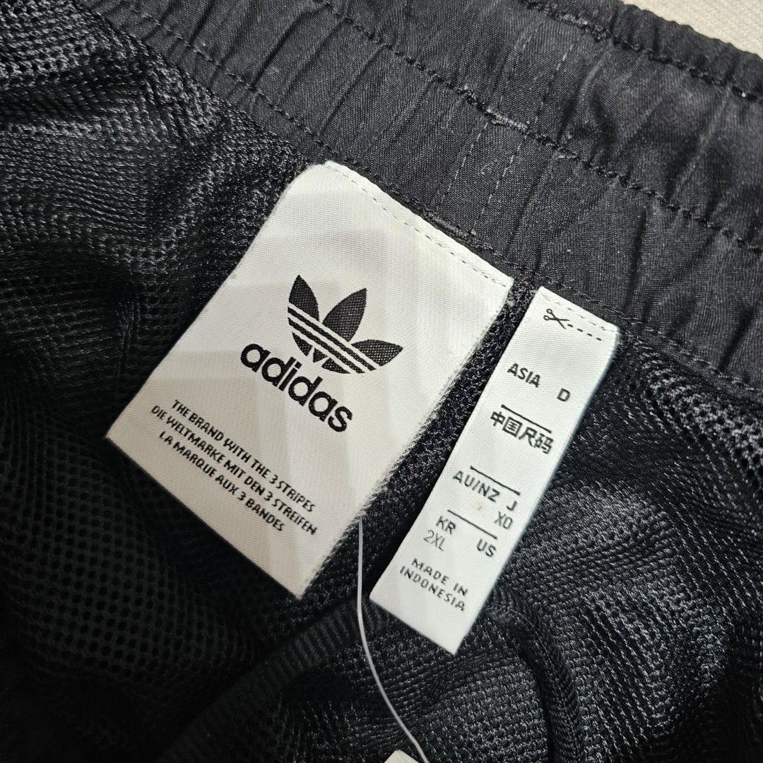 Adidas black shorts (Category: Shorts) located in Baguio. Submitted by kayeonlineshop (Listing ID 1463999123, Image 3). Description: black Adidas athletic shorts featuring classic white three-stripe side detailing and the signature Trefoil logo w34-40 l 17 h26.