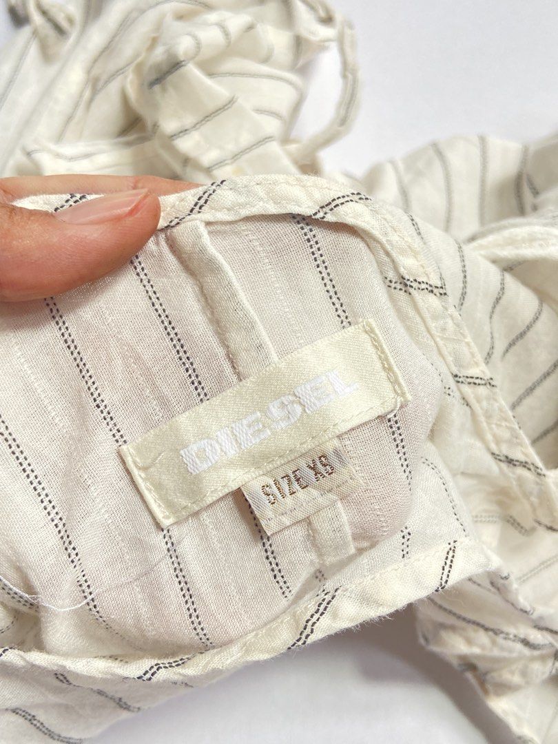 Diesel Babydoll Top (Category: Blouses) located in Manila. Submitted by carefreegarments3 (Listing ID 1463942680, Image 3). Description: ｡‧₊˚𖦹°‧🧚‍♀️₊˚✩ ‧ ୨୧ ‧₊˚ ⋅ ୨୧Babydoll✨ ♡XS-S Brand: Diesel —Very pretty, self tie, excellent condition.