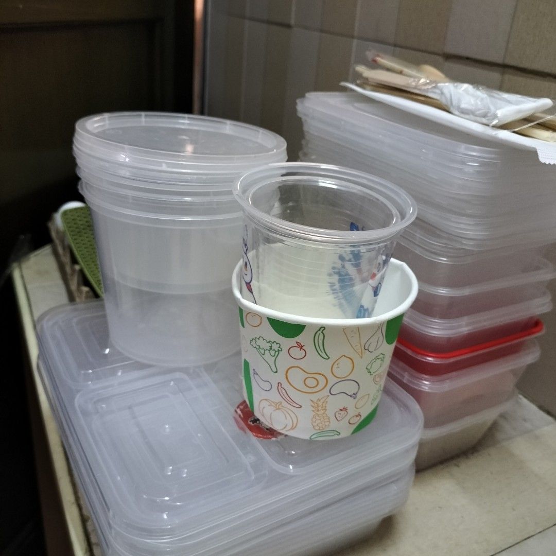 Disposable Food Containers, Cups, and Cutlery Set (Category: Food Organization & Storage) located in Paranaque City. Submitted by decluttering-all (Listing ID 1464132191, Image 1). Description: - Bundle of disposable food containers and cups - Includes various sizes of clear plastic containers with lids - Also includes printed paper cups - Comes with wooden cutlery - Ideal for parties, events, or food business takeaway - All items are clean and r
