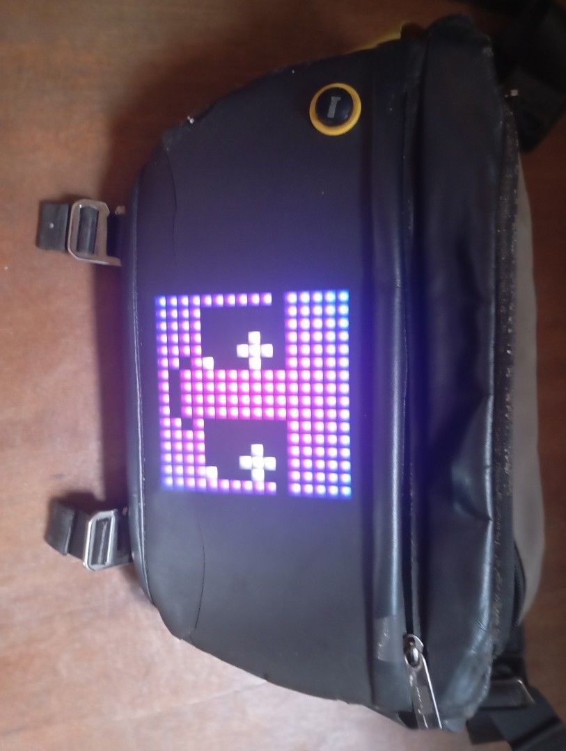 Divooom Sling Bag with LED Display (Category: Sling Bags) located in Valenzuela. Submitted by hyrotitania (Listing ID 1463996299, Image 1). Description: for sale Divooom slingbag for declutter -panel is still working but the wire has to be in right position to work -dirty -thw sides beside the led panel has cracked due to sunlight fixed 600 pickup Valenzuela dalandanan loc .