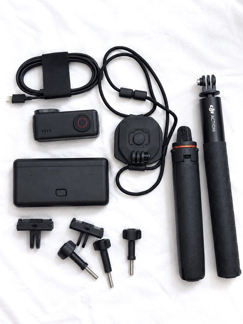 DJI Action 5 Pro Combo Set with Accessories (Category: Video Cameras) located in Manila. Submitted by mpradofyou (Listing ID 1464040092, Image 2). Description: - DJI Action 5 pro in Black - Includes camera and front touchscreen module - Magnetic mounting options for easy attachment - Comes with extra batteries and charging case - Grip extender included - Perfect for capturing all your adventures.