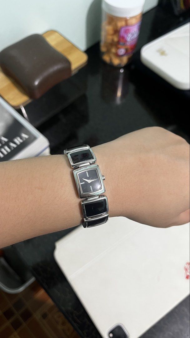 DKNY Y2K silver-tone bracelet watch (Category: Women's Watches) located in Lucena. Submitted by needfundsforojt (Listing ID 1463944357, Image 1). Description: (Personal Preloved) DKNY distinctive rectangular black links and a minimalist square black dial. - bought as is - some visible scratches - need battery replacement FREE DELIVERY 📦 NO COD! PAYMENT FIRST ☺️ MOP: Gcash/Landbank/Gotyme Bank.