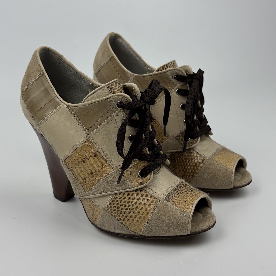 Dolce & Gabbana Snakeskin Patchwork Wedge Heels Sandal (Category: Sneakers & Footwear) located in Bacolod City. Submitted by cast.archives (Listing ID 1463966231, Image 1). Description: Dolce & Gabbana Snakeskin Patchwork Wedge Heels Sandal Size: 6.5 Condition: Excellent Flaw: None.