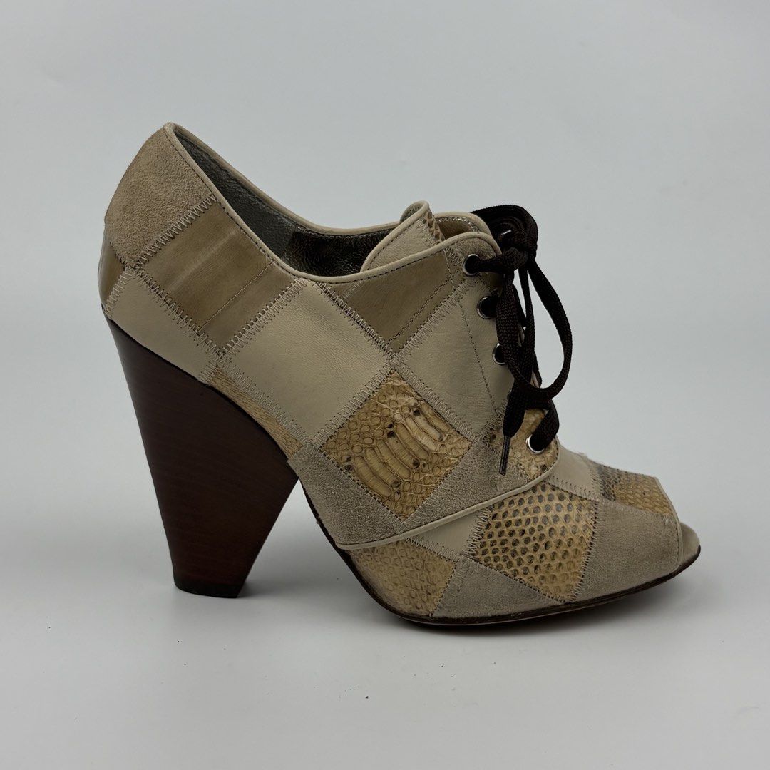 Dolce & Gabbana Snakeskin Patchwork Wedge Heels Sandal (Category: Sneakers & Footwear) located in Bacolod City. Submitted by cast.archives (Listing ID 1463966231, Image 2). Description: Dolce & Gabbana Snakeskin Patchwork Wedge Heels Sandal Size: 6.5 Condition: Excellent Flaw: None.