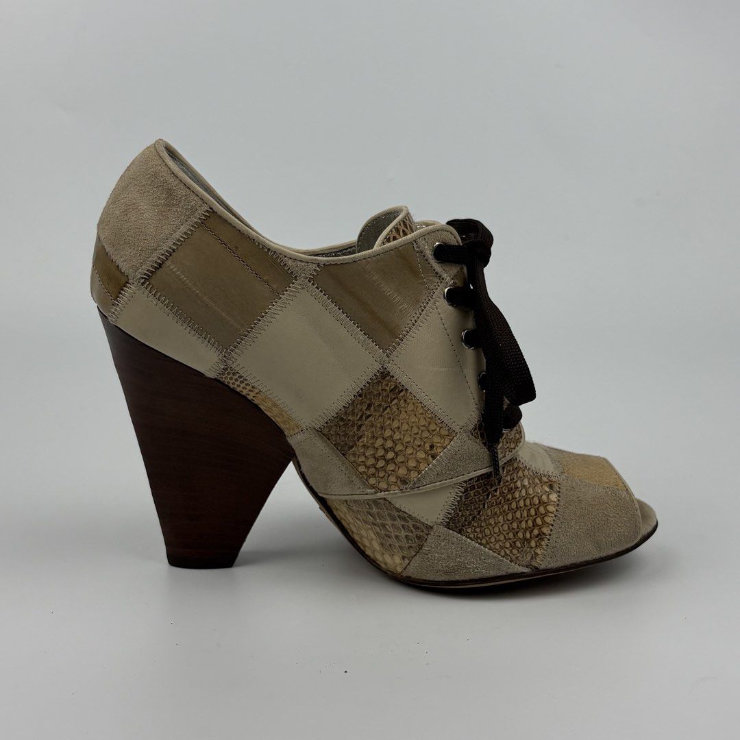 Dolce & Gabbana Snakeskin Patchwork Wedge Heels Sandal (Category: Sneakers & Footwear) located in Bacolod City. Submitted by cast.archives (Listing ID 1463966231, Image 3). Description: Dolce & Gabbana Snakeskin Patchwork Wedge Heels Sandal Size: 6.5 Condition: Excellent Flaw: None.