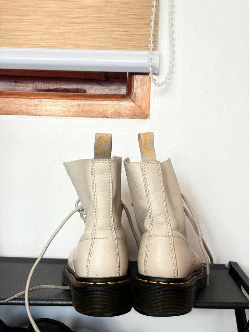 Dr. Martens 1460 Cream Leather Boots (Category: Boots) located in Mandaluyong City. Submitted by mommytinderella (Listing ID 1463953039, Image 2). Description: - Cream white Dr. Martens boots - Classic 8-eyelet lace-up style - Made in Vietnam - Minor scuffs and marks on leather - Yellow heel loops intact - Pre-loved and ready for a new owner RFS: outgrown fast due to growth spurt. .