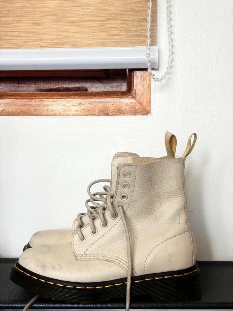 Dr. Martens 1460 Cream Leather Boots (Category: Boots) located in Mandaluyong City. Submitted by mommytinderella (Listing ID 1463953039, Image 1). Description: - Cream white Dr. Martens boots - Classic 8-eyelet lace-up style - Made in Vietnam - Minor scuffs and marks on leather - Yellow heel loops intact - Pre-loved and ready for a new owner RFS: outgrown fast due to growth spurt. .