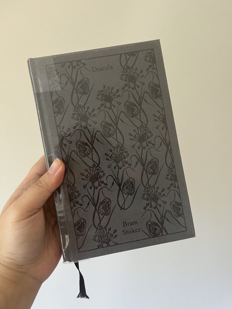 Dracula by Bram Stoker Hardcover Book (Category: Storybooks) located in Manila. Submitted by freemoon-41a552 (Listing ID 1463970662, Image 1). Description: - Classic Dracula novel by Bram Stoker - Hardcover edition - Features a dark floral design on the cover - Includes a black ribbon bookmark - Ideal for fans of classic horror literature - A great addition to any book collection.