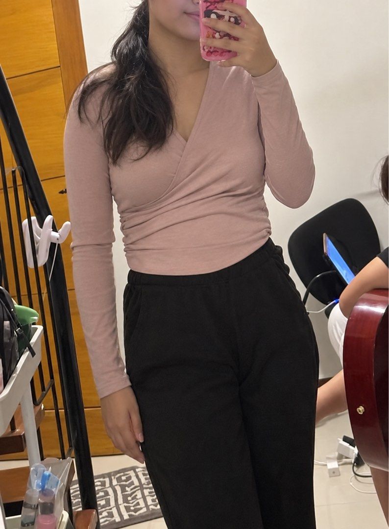 Dusty Pink Long Sleeve Wrap Bodysuit (Category: Others Tops) located in Antipolo. Submitted by chamm_424 (Listing ID 1464113726, Image 1). Description: * Long sleeves (medium) * Wrap-style V-neck design * Fitted and flattering silhouette * Bodysuit style with bottom snap closure.