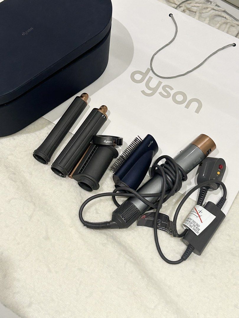 Dyson Airwrap US version (Category: Hair Accessories) located in Manila. Submitted by jeszzz.404 (Listing ID 1464083635, Image 1). Description: ✨ DYSON AIRWRAP™ MULTI-STYLER & DRYER Preloved • US Version • 120V Elevate your everyday hair routine with the iconic Dyson Airwrap™ — designed to curl, wave, smooth, and style without extreme heat. 🤍 Condition: • Preloved, well-maintained • Fully tested & working perfectly • Good overall condition • Aut