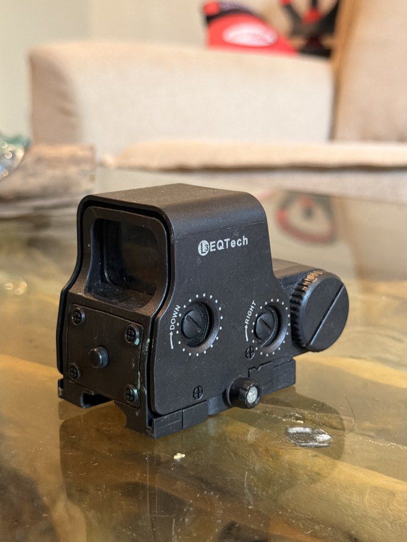 EOTech Holographic Sight Replica (Category: Action & Battle Toys) located in Davao. Submitted by t0lits (Listing ID 1463983991, Image 2). Description: - EOTech style holographic sight - Adjustable windage and elevation knobs - Visible reticle - Marked 'For Law Enforcement/Military Use' - Mounts onto a rail system - Ideal for airsoft or replica builds.