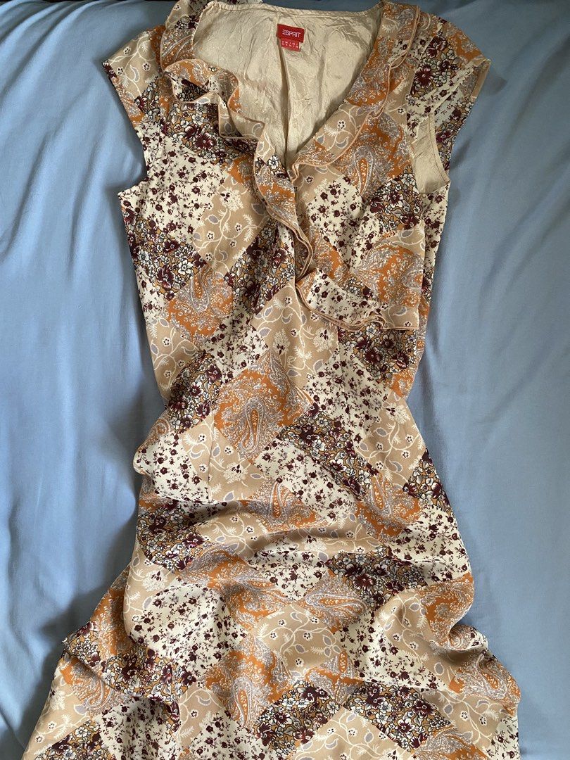 Esprit Patchwork Floral Ruffle V-Neck Dress (Category: Dresses) located in Manila. Submitted by heyheyruok (Listing ID 1463985809, Image 1). Description: - Esprit dress with a unique patchwork floral and paisley print. - Features a flattering ruffled V-neckline. - Comfortable cap sleeves - Lightweight and flowy fabric for a relaxed fit. - Beautiful color palette of beige, orange, and burgundy. - Ideal for casual outings or summer gatherings..