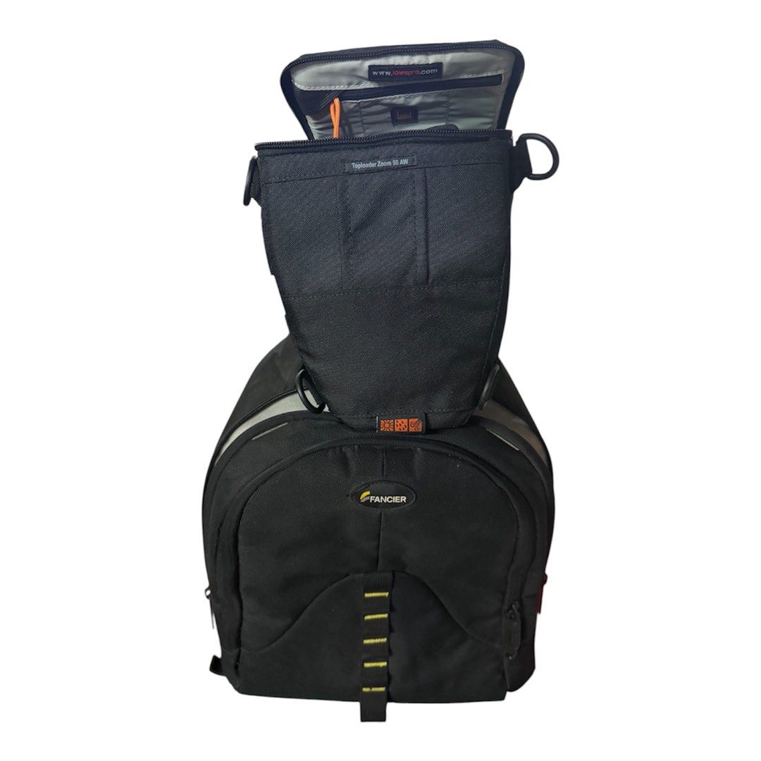 Fancier Black Camera Backpack with Toploader Bag (Category: Camera Bags & Carriers) located in Pasig City. Submitted by annabanana09 (Listing ID 1463954245, Image 1). Description: - Black Fancier camera backpack - Includes detachable toploader zoom bag - Ample storage for camera gear - Zippers in excellent working condition - Adjustable straps for comfortable carrying - Ideal for photographers needing mobility - Ready for your next photography ad