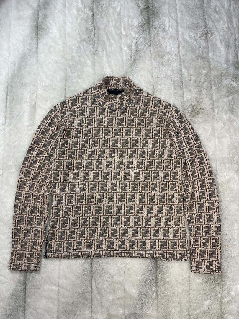 Fendi FF Monogram Mock Neck Long Sleeve Shirt (Category: Longsleeves) located in Manila. Submitted by ljbalza (Listing ID 1463958113, Image 1). Description: - Classic Fendi mock neck shirt - All-over FF monogram print in brown and beige - Long sleeves - Great piece for Fendi fans.