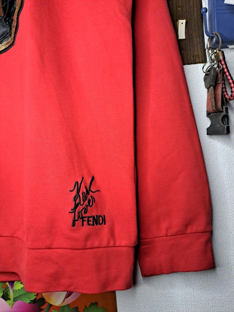 Fendi Roma 1925 x Karl Vibrant Red (Category: Luxury Apparel) located in Quezon City. Submitted by yaseen73 (Listing ID 1464113877, Image 3). Description: Fendi Roma 1925 Circular Logo x Karl Loves Fendi Vibrant Red Sweatshirt With Black Cursive Embroidery "Karl Loves Fendi" Along Side the Classic Brand Logo Cotton Spandex Made in Italy Wearing Size : 2XL on Tag Dimensions : Please Refer to the Photo Needs Re - Wash (With Black Dot Stain on the R