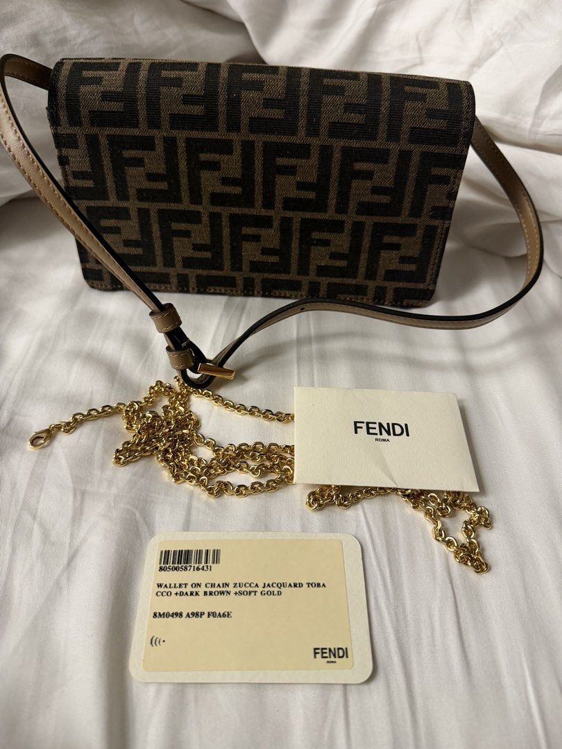 Fendi Zucca Jacquard Wallet on Chain Bag (Category: Luxury Bags & Wallets) located in Makati City. Submitted by arkera.274 (Listing ID 1464051996, Image 2). Description: Fendi wallet on chain in Zucca jacquard. Dark brown with soft gold hardware. Includes dust bag, box, and authenticity cards. Chain strap is detachable. Great for essentials..