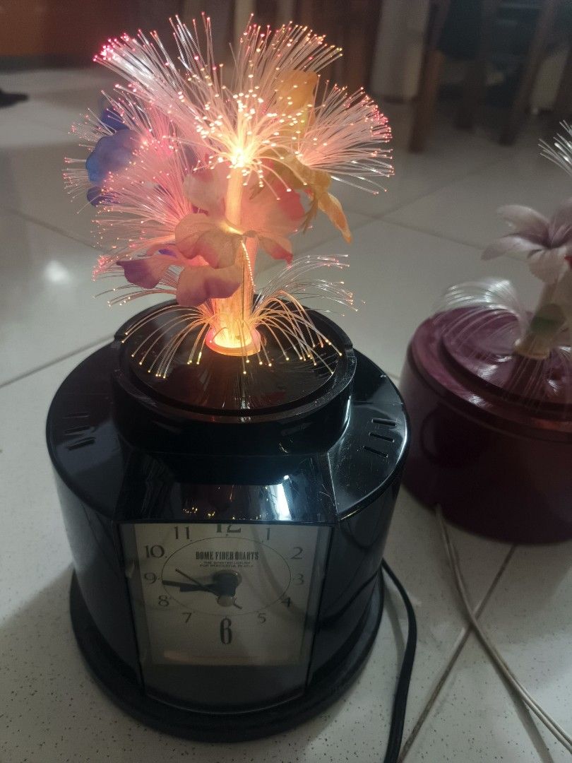 Fiber Optic Lamp with Clock - Color Changing Light (Category: Lighting) located in Santa Rosa. Submitted by rare_findsphbyleo (Listing ID 1463968896, Image 1). Description: - Unique 2-in-1 design: Fiber optic lamp and quartz clock combined! Christmas decor - Mesmerizing color-changing fiber optic lights for ambient glow. - Sleek black base with a clear clock face. - Adds a beautiful decorative touch to any room. - 110 volts needs transformer japa