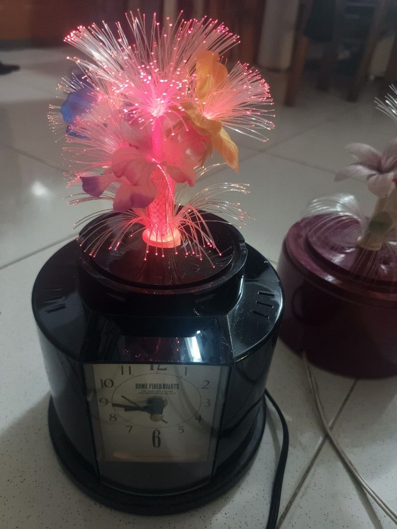 Fiber Optic Lamp with Clock - Color Changing Light (Category: Lighting) located in Santa Rosa. Submitted by rare_findsphbyleo (Listing ID 1463968896, Image 2). Description: - Unique 2-in-1 design: Fiber optic lamp and quartz clock combined! Christmas decor - Mesmerizing color-changing fiber optic lights for ambient glow. - Sleek black base with a clear clock face. - Adds a beautiful decorative touch to any room. - 110 volts needs transformer japa
