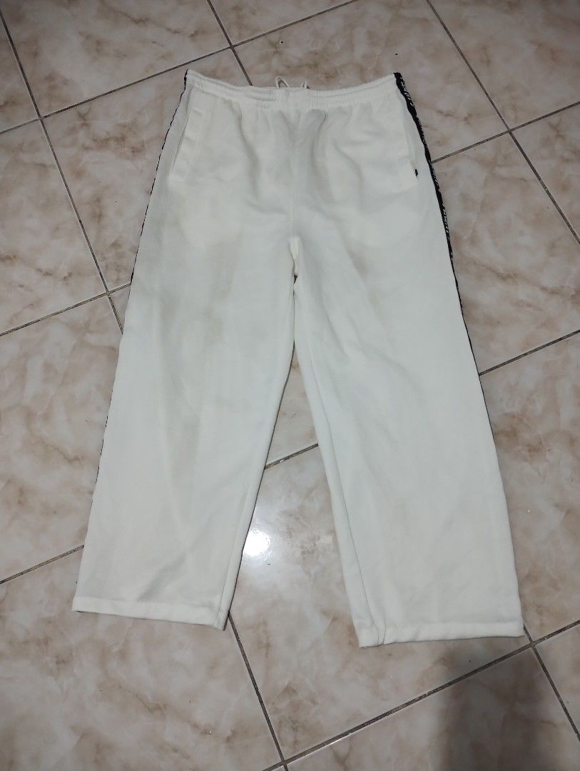 FOCATY HOUSE White Track Pants (Category: Joggers) located in Imus. Submitted by darylg88358770 (Listing ID 1464081502, Image 1). Description: - Brand: FOCATY HOUSE - Color: White - Size: 2L - Features: Side stripe with repeated brand name, elastic waistband with drawstring - Ideal for: Casual wear, lounging the items trifted fresh from bale need wash issue kita sa last pic dumi washable good condition dimes 34x40w 40l .