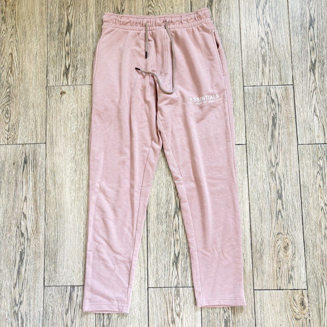 FOG Essentials Pink Cotton Sweatpants (Category: Other Bottoms) located in Imus. Submitted by reloved.nd (Listing ID 1464071920, Image 1). Description: - Brand: Fear of God Essentials - Color: Pink - Material: 100% Cotton - Features: Essentials logo print on leg, elastic waistband with drawstring, two side pockets - Style: Ideal for lounging or casual wear.