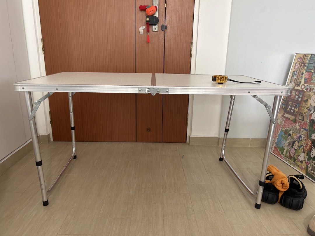 Foldable table (Category: Tables & Sets) located in Singapore. Submitted by younggggg (Listing ID 1463980592, Image 2). Description: Foldable table. Dimensions when fully opened: 117cm x 60cm When closed: 58.5cm x 60cm.