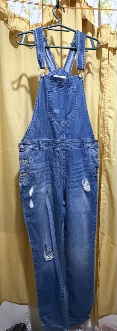 Forever 21 Blue Denim Distressed Overalls (Category: Jumpsuits) located in Manila. Submitted by nayeoniescart (Listing ID 1464104959, Image 3). Description: PRE LOVED: Forever 21 blue denim overalls MOD: jnt / MOP: gcash Size: US 30 / EU 44 - Distressed look with rips on legs and bib - Adjustable straps - Button closures on sides - Multiple front and back pockets - Ideal for a casual, edgy style.