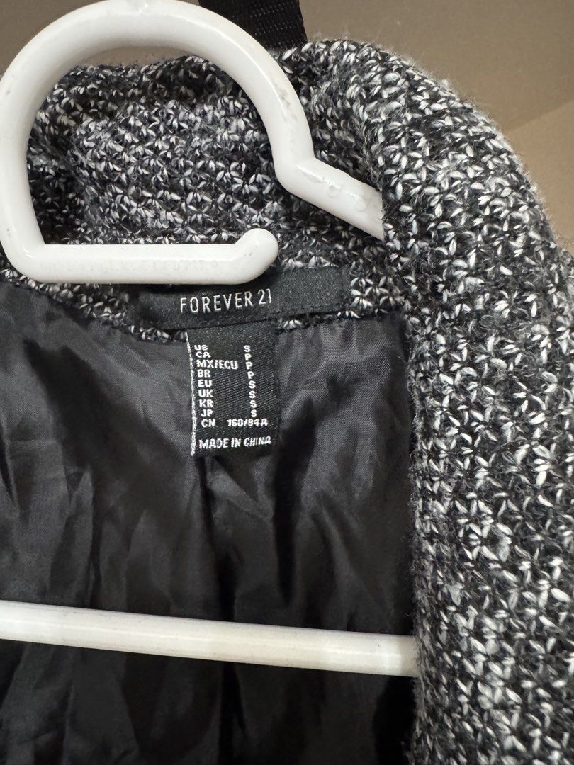 Forever 21 Grey & Black Tweed Double-Breasted Blazer Jacket (Category: Coats, Jackets and Outerwear) located in Paranaque City. Submitted by kgsantos (Listing ID 1463943738, Image 2). Description: - Grey and black tweed blazer from Forever 21 - Double-breasted style with button closure - Fully lined with black satin - Versatile for casual or semi-formal occasions - Great for layering.