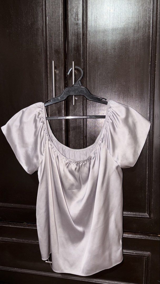 Forever 21 Grey Off-Shoulder Satin Top (Category: Blouses) located in Manila. Submitted by keenfox-84bb (Listing ID 1464025070, Image 1). Description: - Grey off-shoulder top from Forever 21 - Made of satin material - Features short sleeves and a gathered neckline - Note: Small dent/mark on fabric near hem (refer to last photo for details).