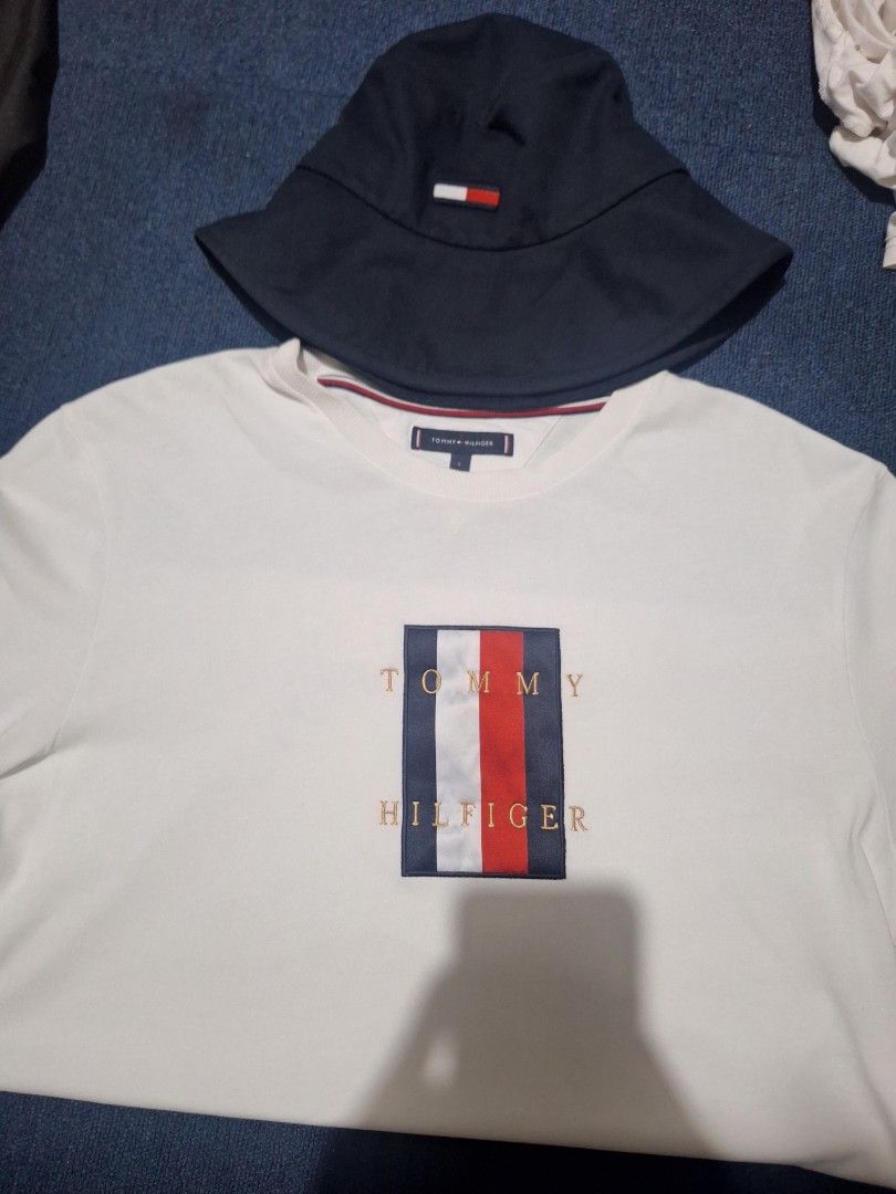 Forsale aspack size large .men (Category: Caps & Hats) located in Manila. Submitted by adolphreyes645 (Listing ID 1464068101, Image 1). Description: - Tommy Hilfiger White T-Shirt - Size: Large (L) - Material: 100% Organic Cotton - Features classic embroidered flag logo on front - Tommy Hilfiger Navy Bucket Hat - Includes small flag detail - Ideal for casual wear.