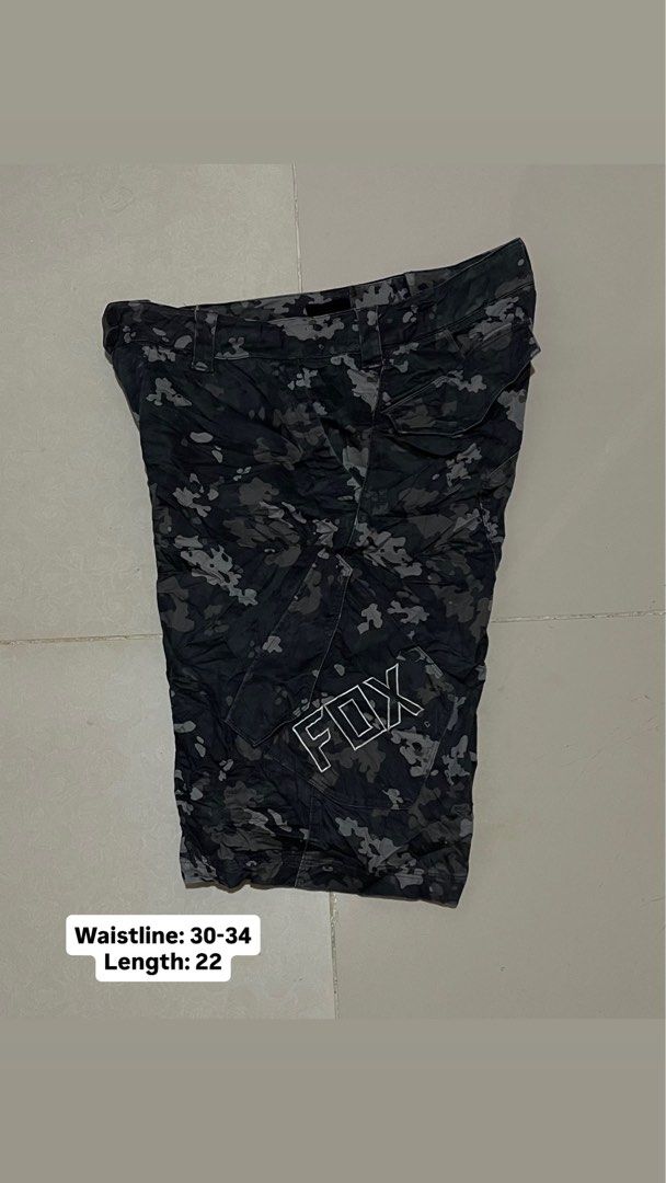 Fox Racing Sergeant Camo Cargo Shorts Size 32 (Category: Shorts) located in Manila. Submitted by micoletszx81430 (Listing ID 1464072616, Image 1). Description: - Brand: Fox Racing - Style: Cargo Shorts - Color: Black & Grey Camo - Waist Size: Fits 30-34 inches (Tag Size 32) - Length: 22 inches - Features: Multiple pockets - Ideal for: Casual wear, outdoor activities.