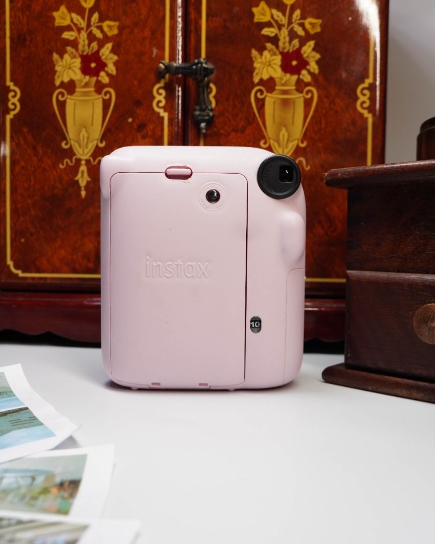 FUJIFILM INSTAX MINI 12 DISPLAY UNIT — ₱499 (Category: Cameras) located in Las Pinas. Submitted by retrocameraph (Listing ID 1464080927, Image 3). Description: 📸 FUJIFILM INSTAX MINI 12 DISPLAY UNIT — ₱499 It looks like an Instax Mini 12, feels like one in the hand, and even has that unmistakable Blossom Pink finish — but this one has a different purpose. 🌸 This is a rare Fujifilm display unit, made for display rather than taking photos. A fun 