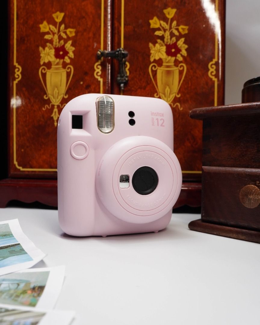 FUJIFILM INSTAX MINI 12 DISPLAY UNIT — ₱499 (Category: Cameras) located in Las Pinas. Submitted by retrocameraph (Listing ID 1464080927, Image 2). Description: 📸 FUJIFILM INSTAX MINI 12 DISPLAY UNIT — ₱499 It looks like an Instax Mini 12, feels like one in the hand, and even has that unmistakable Blossom Pink finish — but this one has a different purpose. 🌸 This is a rare Fujifilm display unit, made for display rather than taking photos. A fun 