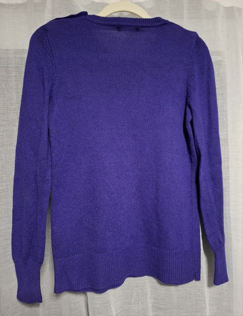Gap Purple Crew Neck Sweater with Button Detail (Category: Longsleeves) located in Manila. Submitted by jazil.ladyliz (Listing ID 1464073524, Image 2). Description: - Purple Gap sweater - Crew neck style - Button details on the left shoulder - Long sleeves with ribbed cuffs and hem - Made from soft knit material - Ideal for layering or wearing solo.