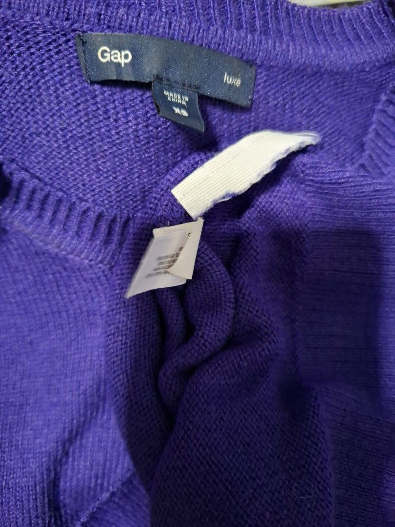 Gap Purple Crew Neck Sweater with Button Detail (Category: Longsleeves) located in Manila. Submitted by jazil.ladyliz (Listing ID 1464073524, Image 3). Description: - Purple Gap sweater - Crew neck style - Button details on the left shoulder - Long sleeves with ribbed cuffs and hem - Made from soft knit material - Ideal for layering or wearing solo.