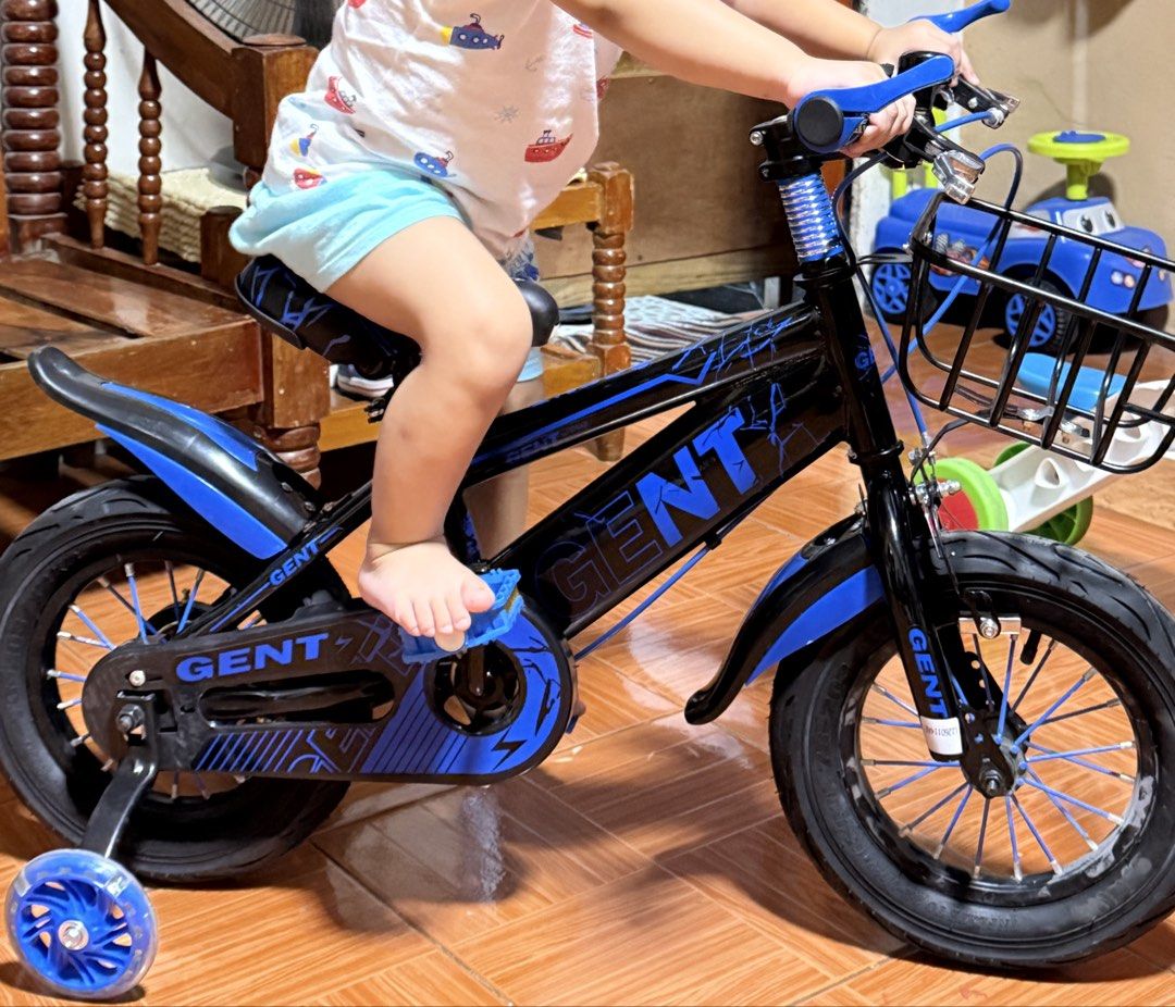 GENT Children's Bicycle with Training Wheels (Category: Bicycles) located in Manila. Submitted by kateintal (Listing ID 1464125063, Image 1). Description: - Black and blue GENT bicycle - Perfect for young riders - Comes with training wheels for easy learning - Features a front basket for convenience - Ready for exciting adventures!.