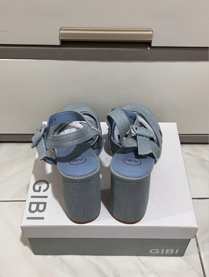 GIBI Denim Platform Block Heels Sandals Size 39 (Category: Heels) located in Koronadal. Submitted by declutterprelovednitine_ey (Listing ID 1463992545, Image 2). Description: Light blue denim sandals from GIBI. Features criss-cross straps on the front and an adjustable ankle strap with a buckle. Chunky block heel and platform sole. Size 39. Comes with the original box. Original price ₱1,800..