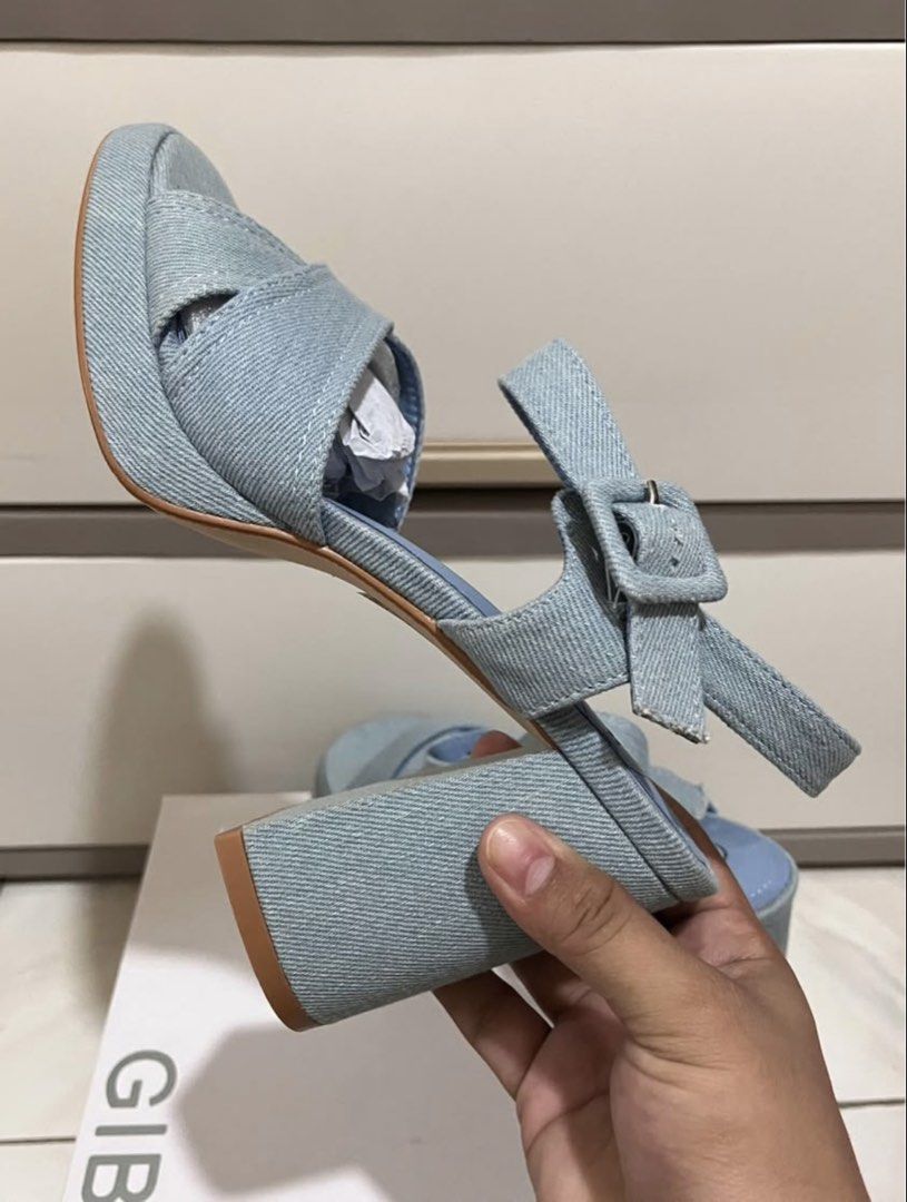 GIBI Denim Platform Block Heels Sandals Size 39 (Category: Heels) located in Koronadal. Submitted by declutterprelovednitine_ey (Listing ID 1463992545, Image 3). Description: Light blue denim sandals from GIBI. Features criss-cross straps on the front and an adjustable ankle strap with a buckle. Chunky block heel and platform sole. Size 39. Comes with the original box. Original price ₱1,800..