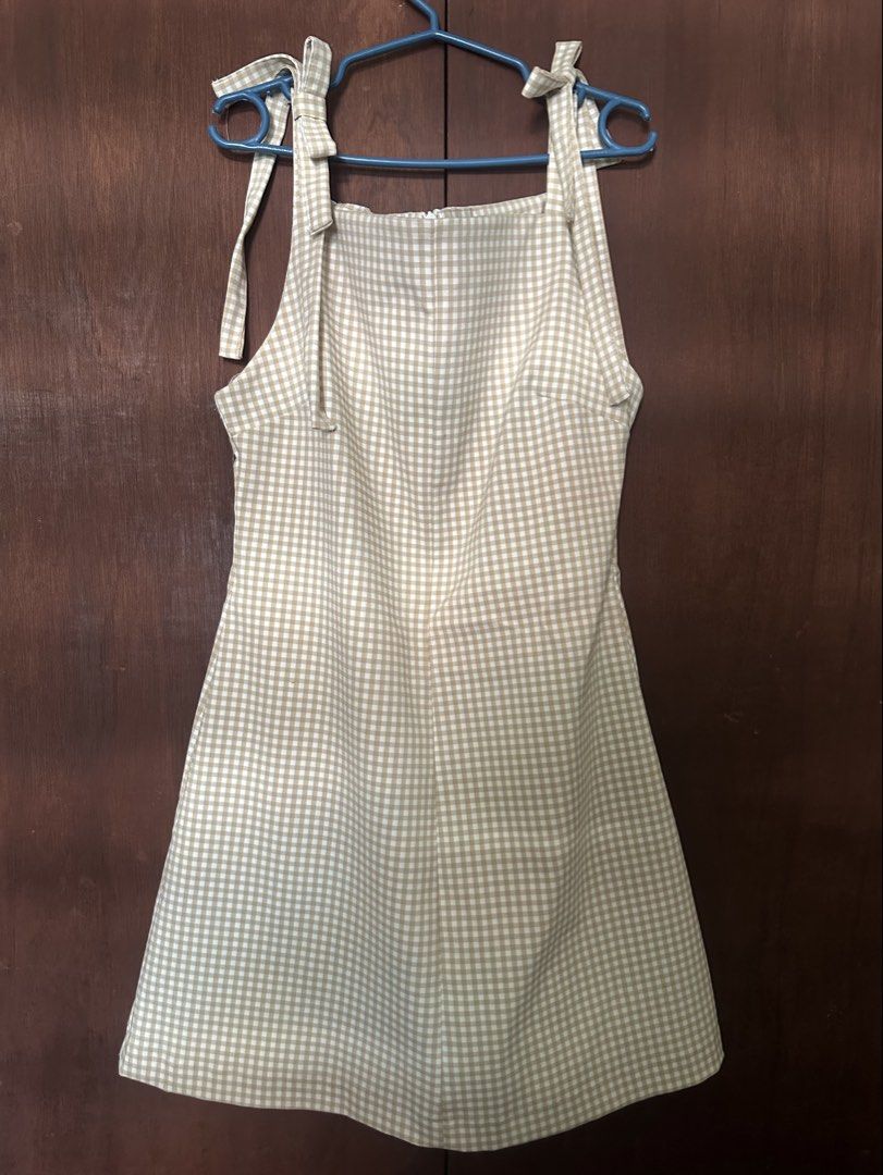 Gingham Pinafore Dress with Tie Straps (Category: Dresses) located in Caloocan City. Submitted by gentlegem_56adf7 (Listing ID 1463782975, Image 1). Description: Cute gingham dress. Features tie straps on the shoulders. Zipper closure at the back. A-line skirt. Great for casual wear or layering. Easy to style with a t-shirt or blouse underneath..