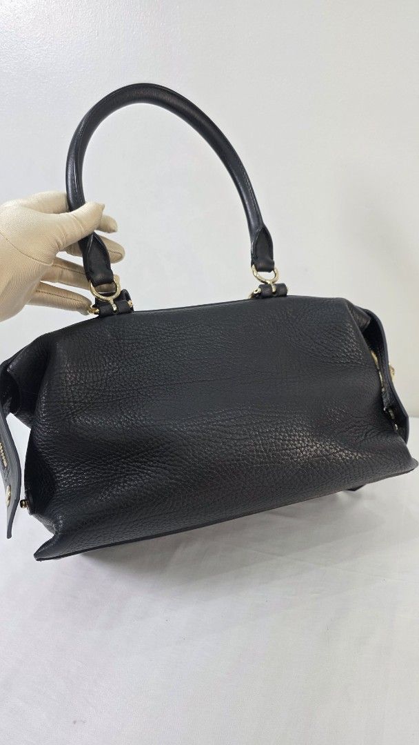 Givenchy Black Leather SWAY (Category: Luxury Bags & Wallets) located in San Fernando. Submitted by bagproject (Listing ID 1464125848, Image 3). Description: - Authentic Givenchy Nightingale handbag - Color: Black - Material: Textured leather - Features: Top handles and a detachable shoulder strap - Hardware: Gold-tone - Interior: Spacious, perfect for essentials - Style: Classic designer piece.