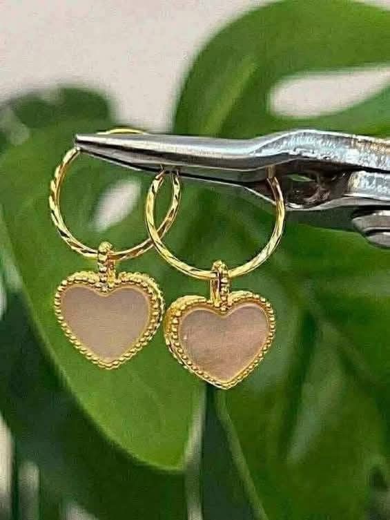 Gold Hoop Earrings with Interchangeable Charms (Category: Earrings) located in Manila. Submitted by shasha153 (Listing ID 1464135299, Image 1). Description: - Pure gold 18k - 10mm vca hoop earrings - Includes multiple charm options: heart, round, clover - Charms available in different colors - Mix and match for versatile styling - Lightweight and comfortable for daily wear - Ideal for gifting or personal treat.