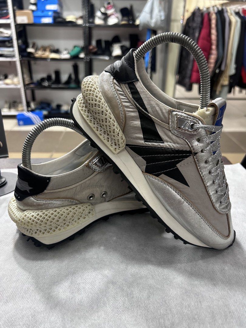 Golden Goose Marathoner Sneakers Silver (Category: Sneakers) located in Pasig City. Submitted by blitzkriegspc (Listing ID 1464136269, Image 1). Description: - Brand: Golden Goose - Model: Marathoner - Size: 40 - Color: Silver with black accents - Key Feature: Unique 3D printed sole - Style: Edgy, statement piece.