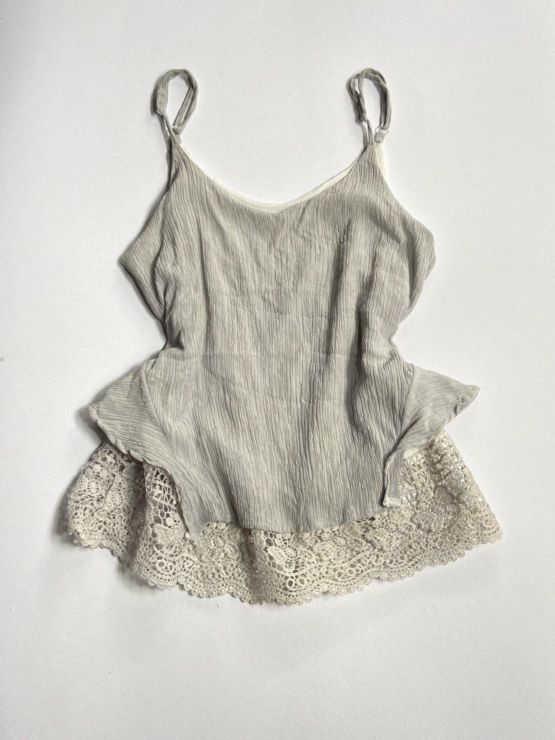 Gray Lacey Top (Category: Blouses) located in Manila. Submitted by carefreegarments3 (Listing ID 1463942567, Image 1). Description: ｡‧₊˚𖦹°‧🧚‍♀️₊˚✩ ‧ ୨୧ ‧₊˚ ⋅ ୨୧Lace Top✨ ♡XS-S —Very pretty, actually color is gray, excellent condition.