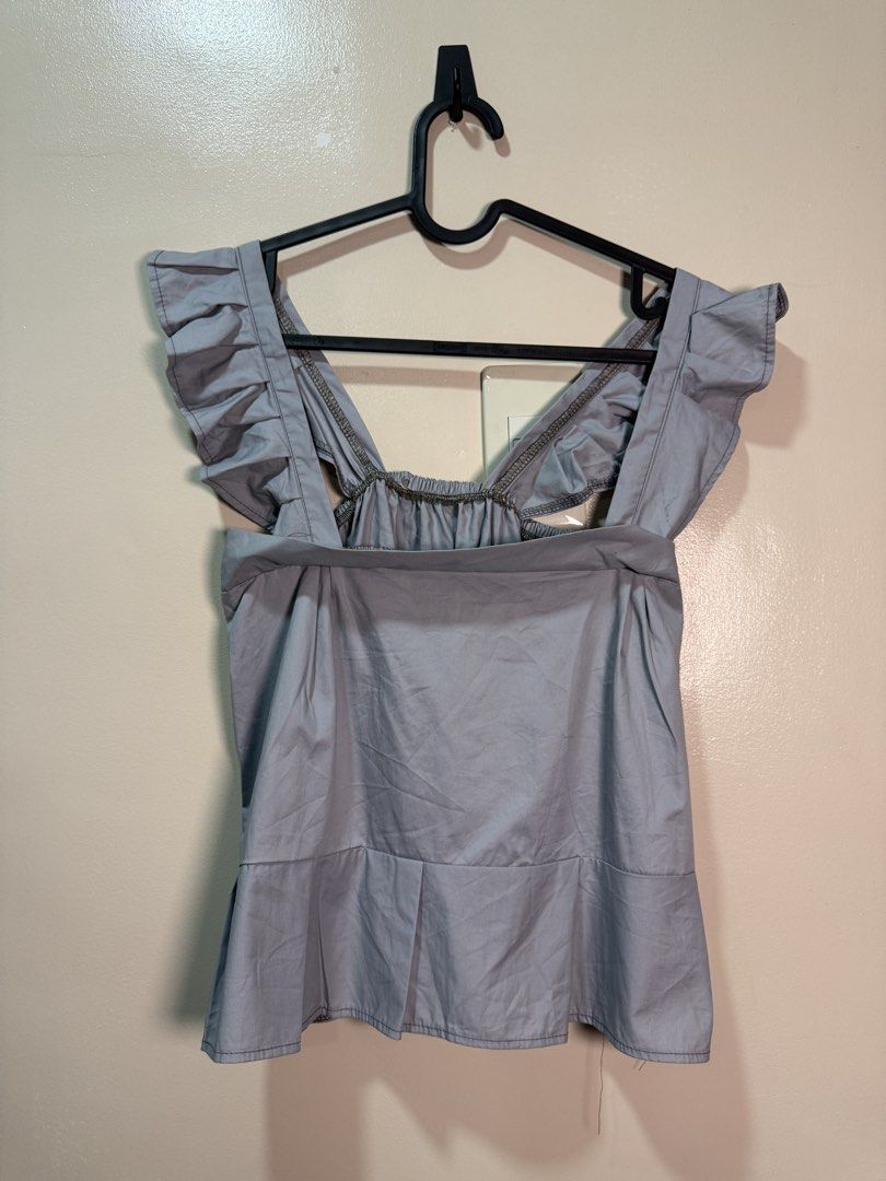 gray sleeveless top (Category: Blouses) located in Quezon City. Submitted by fashionifywardrobe8899 (Listing ID 1464098442, Image 1). Description: 2 pcs avail.