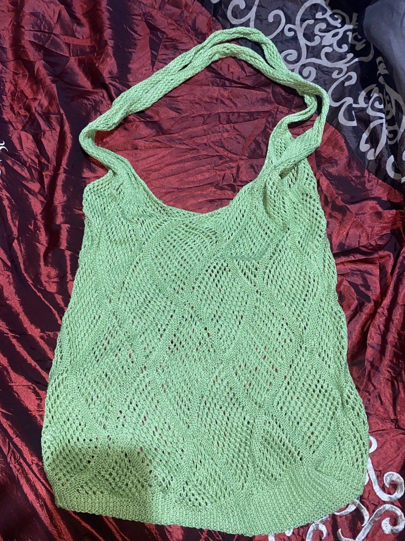 Green nitted bag (Category: Shoulder Bags) located in Manila. Submitted by reginemarquez412 (Listing ID 1464078201, Image 1). Description: - Light green crochet knit tank top - Features a diamond pattern throughout - Two shoulder straps - Versatile for layering or wearing solo - Ideal for summer outfits.