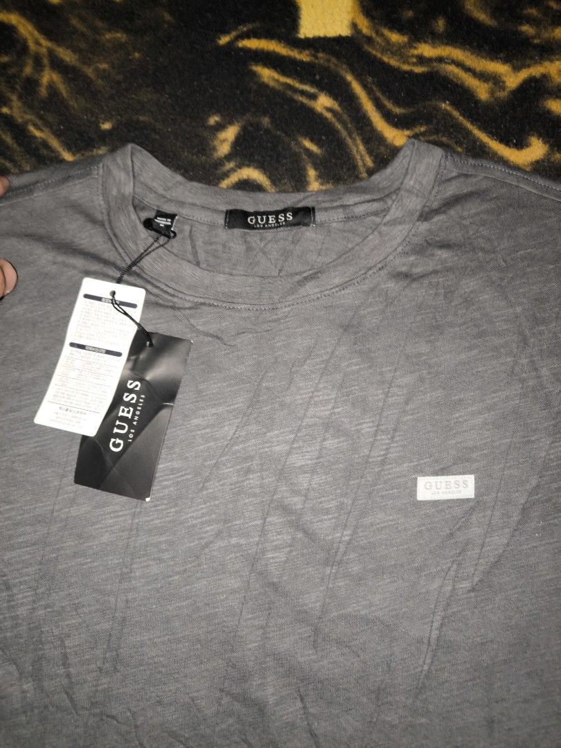 Grey Guess Los Angeles Tee (Category: Tshirts & Polo Shirts ) located in Manila. Submitted by fljaoti27 (Listing ID 1463956954, Image 2). Description: Guess Tee Medium.